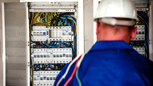 electrician working on electrical panel