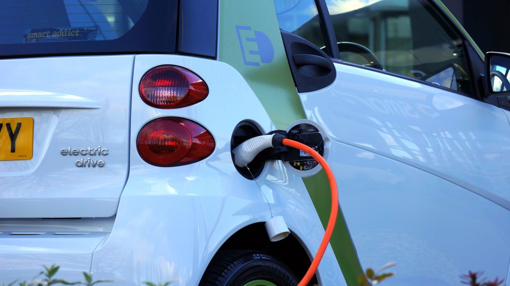 Electric car charging at a charging station